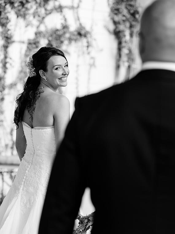 Bride glancing at the groom