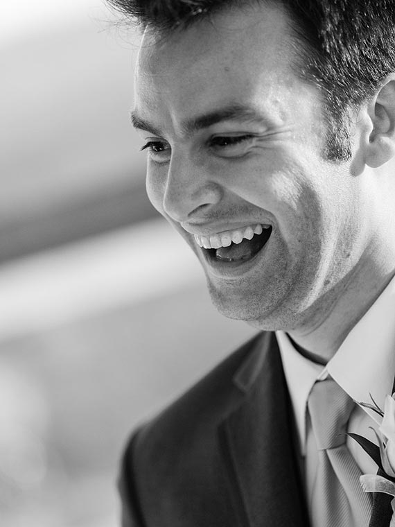 Laughing groom at a vinery in Temecula